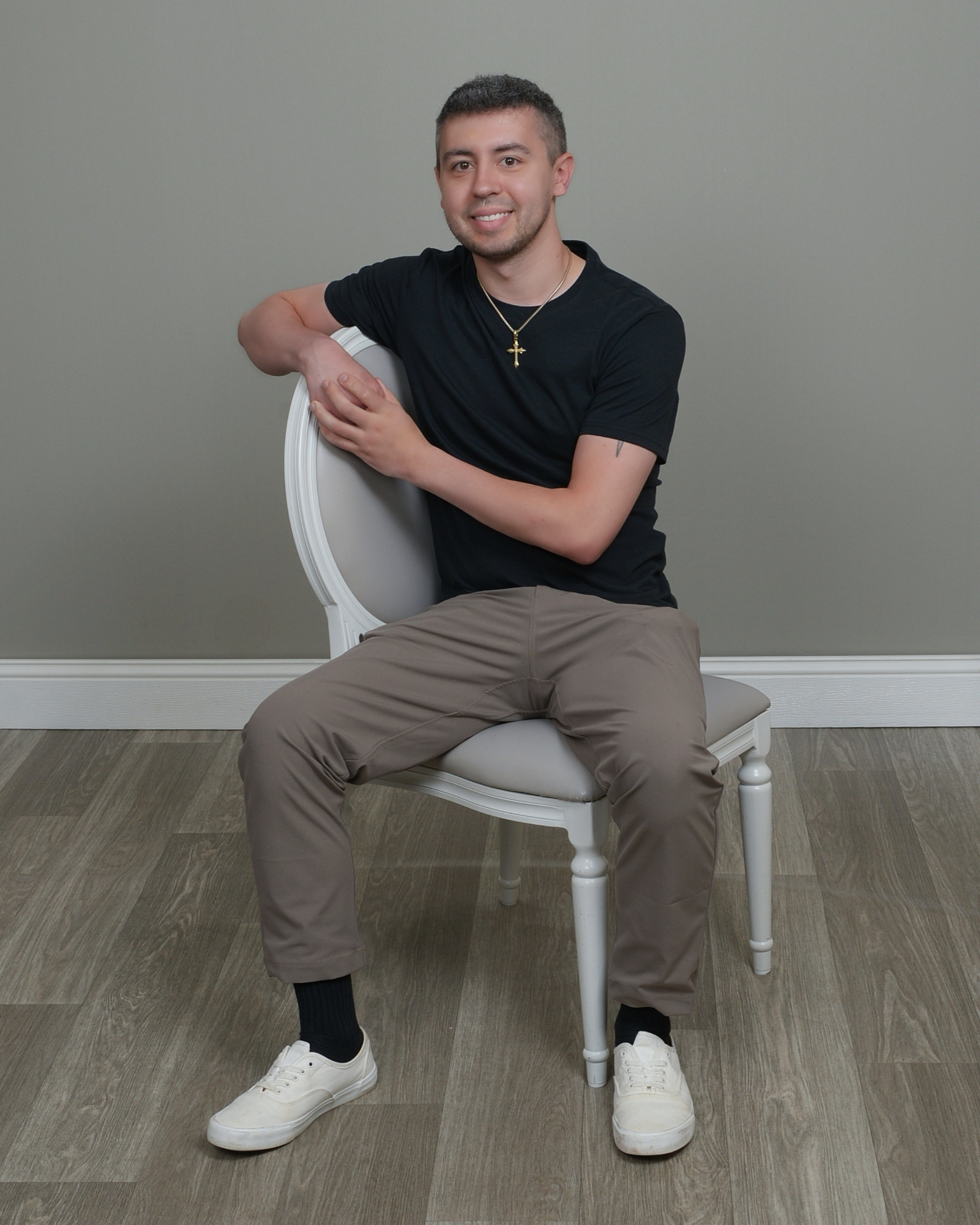 Austin Zsedely seated for a portrait